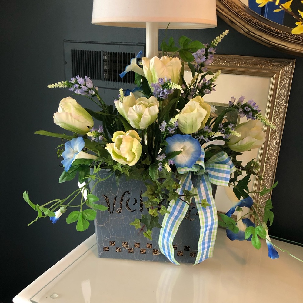 Metal wall pocket filled with summer flowers!